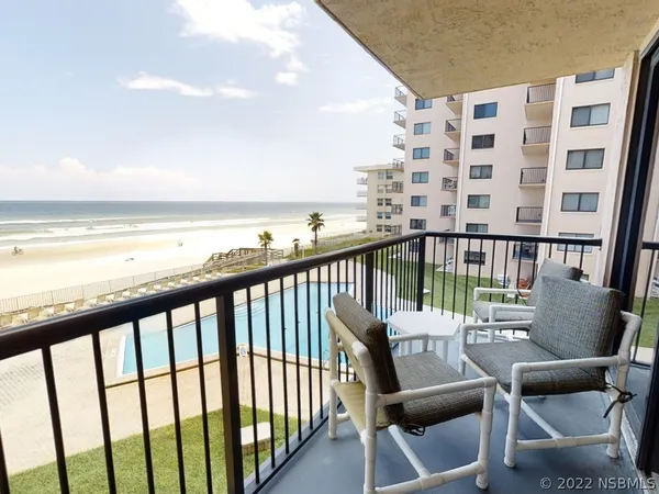 a view of a balcony with chairs