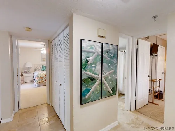 a view of a livingroom from a hallway