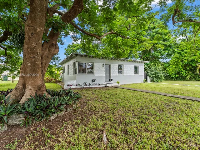 a house view with a garden space