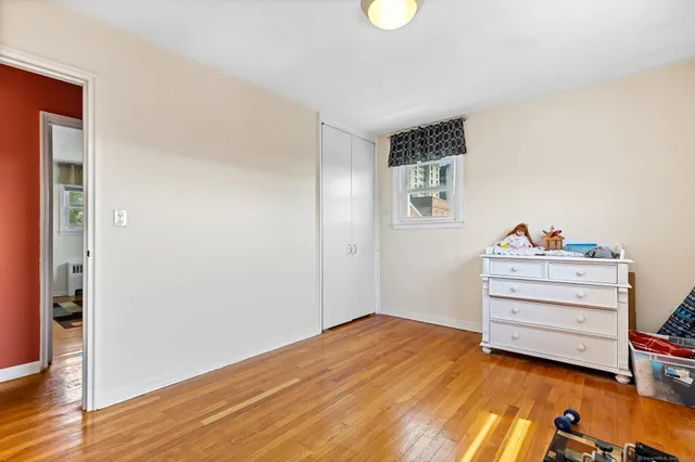 a view of room with toys and wooden floor