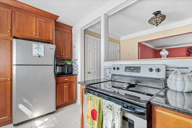 a kitchen with a stove and a refrigerator