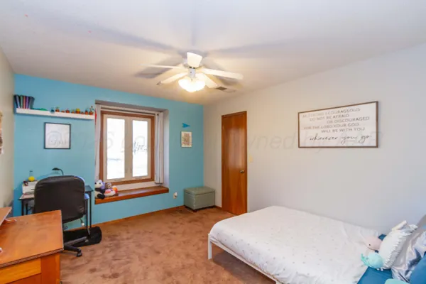 a bedroom with a bed furniture and a window