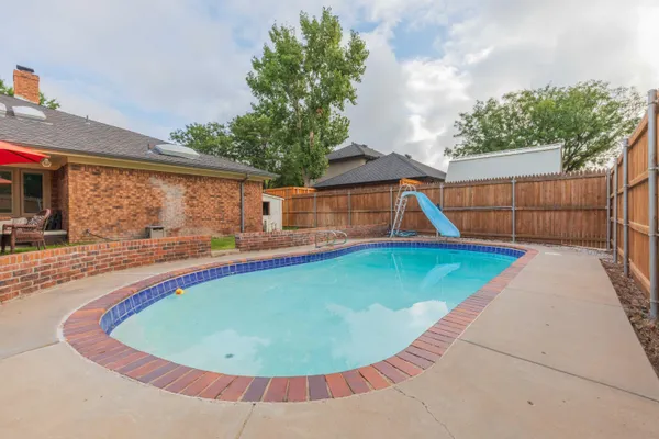 a view of outdoor space and swimming pool