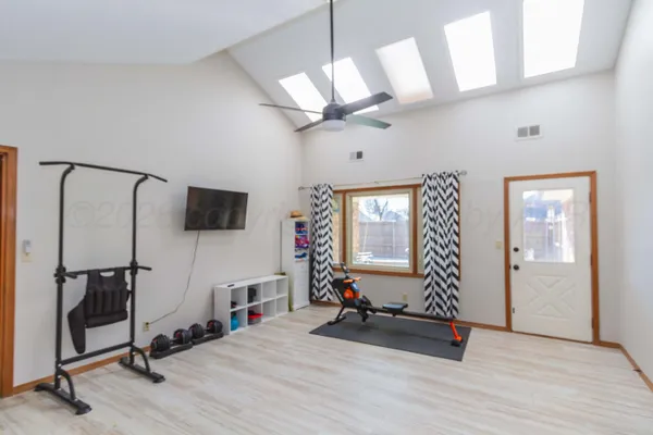 a view of a livingroom with furniture and a window