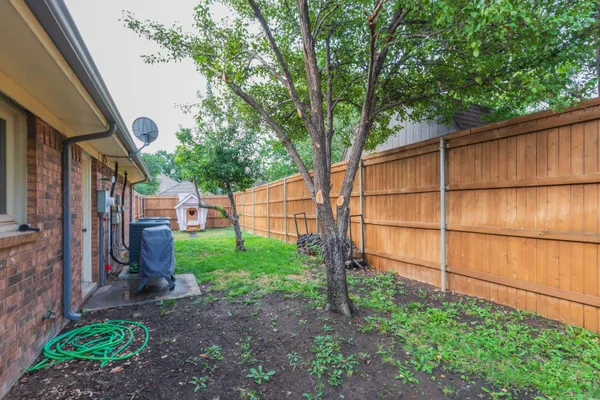 a backyard of a house with lots of green space