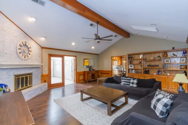 a living room with furniture and a fireplace