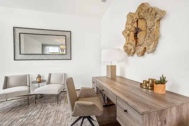 a view of a workspace with furniture