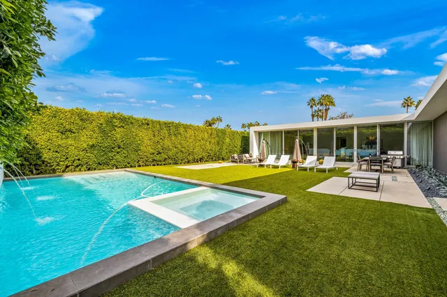 a view of a house with swimming pool