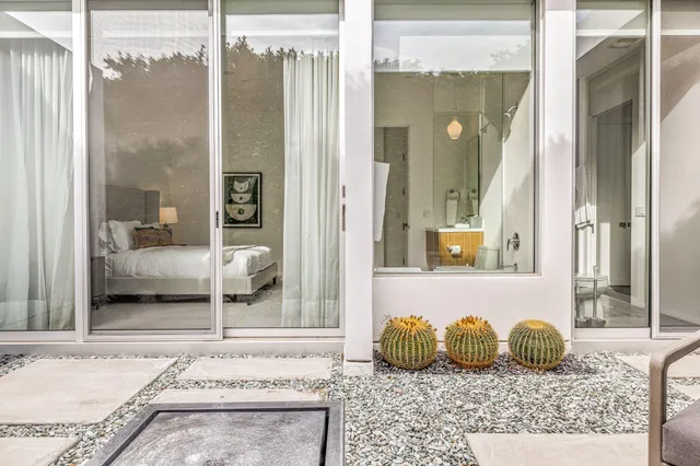 a bathroom with a granite countertop tub and a shower