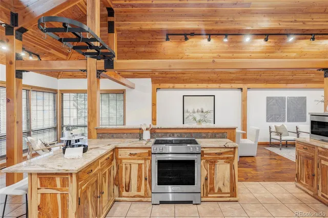 a kitchen with stainless steel appliances granite countertop a stove and a sink