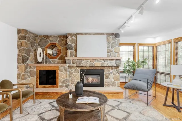 a living room with furniture and a fireplace