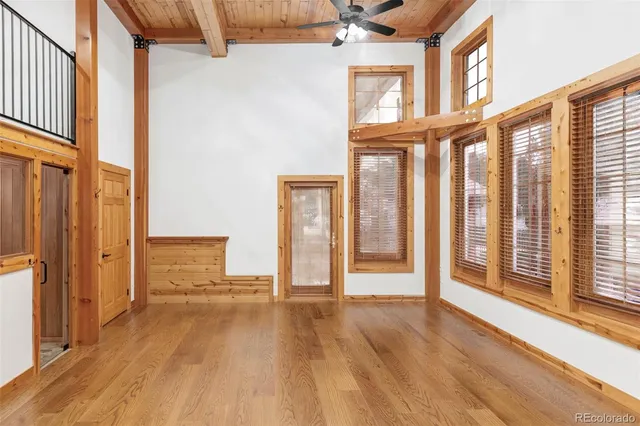 a view of an entryway with wooden floor