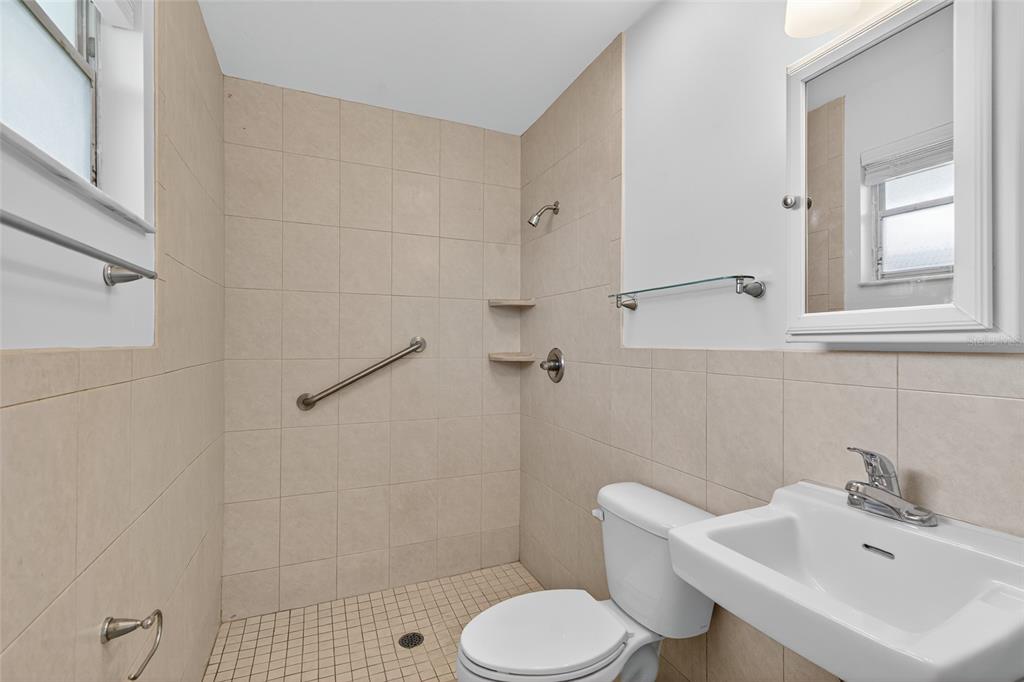 6401 Southwest 78th Street Gainesville, FL 32608 - Photo 13 of 29 a bathroom with a sink toilet and shower