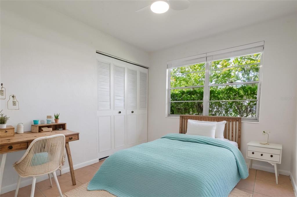 6401 Southwest 78th Street Gainesville, FL 32608 - Photo 14 of 29 a bedroom with a bed and a large window