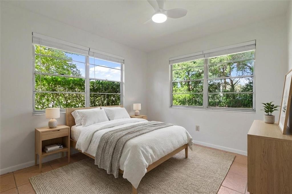 6401 Southwest 78th Street Gainesville, FL 32608 - Photo 15 of 29 a bedroom with a bed and a couch