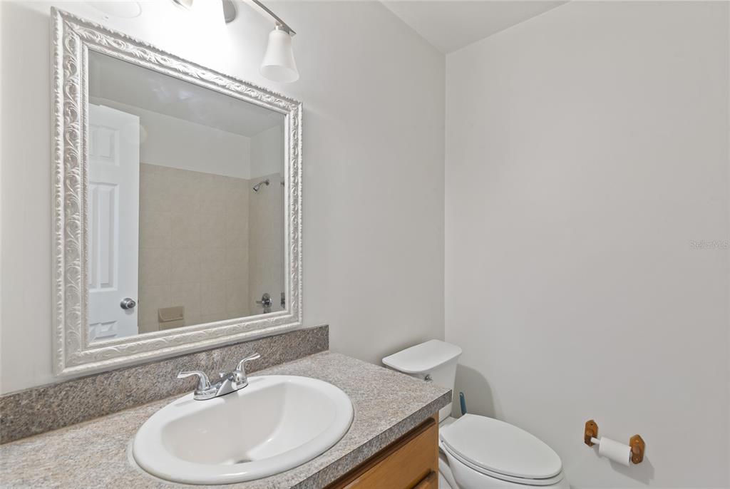 6401 Southwest 78th Street Gainesville, FL 32608 - Photo 16 of 29 a bathroom with a toilet sink and mirror