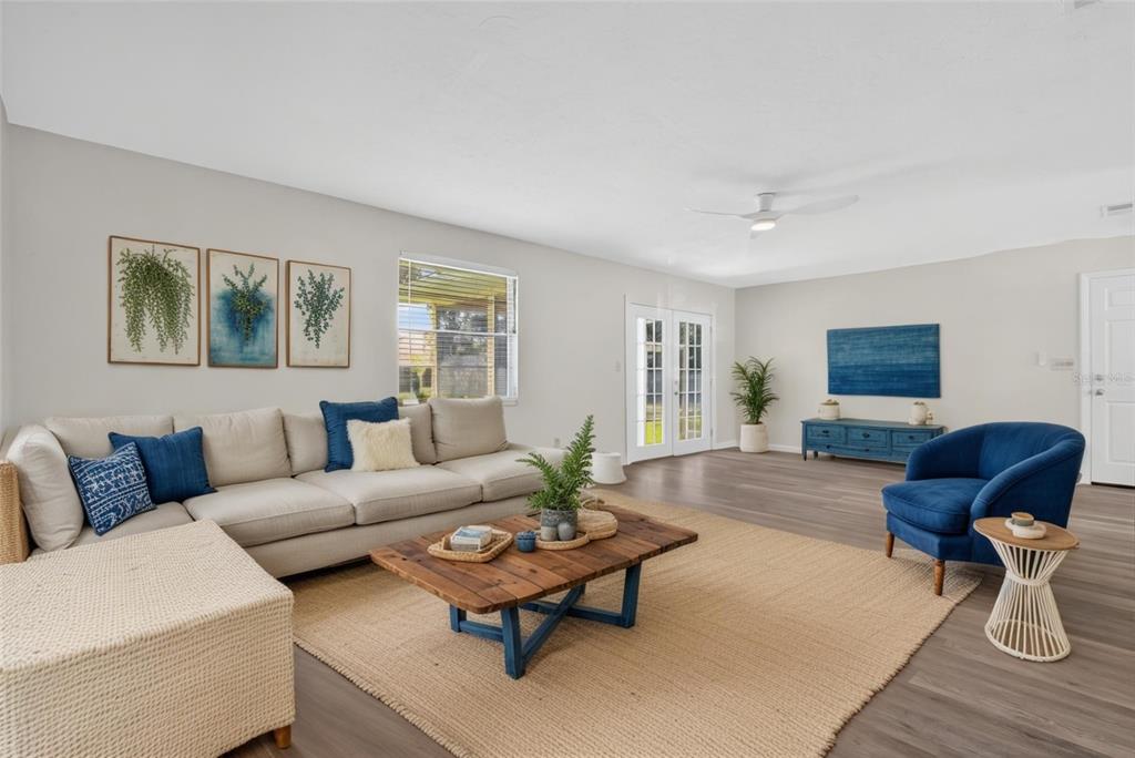 6401 Southwest 78th Street Gainesville, FL 32608 - Photo 10 of 29 a living room with furniture and a wooden floor
