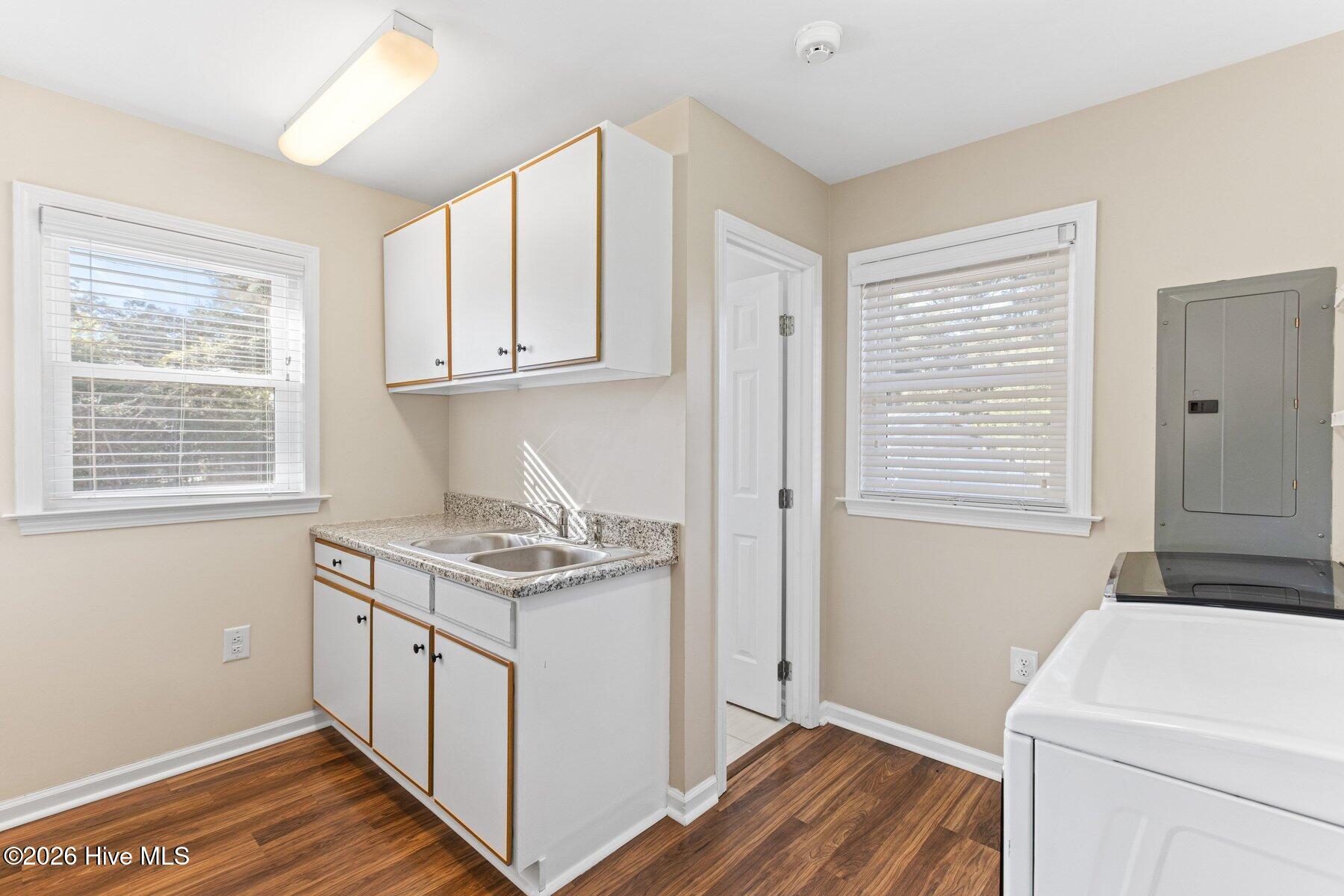 101 Kingston Road Wilmington, NC 28409 - Photo 12 of 47 laundry room with half bath and prep sink