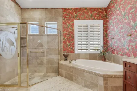 a bath tub sitting next to a shower