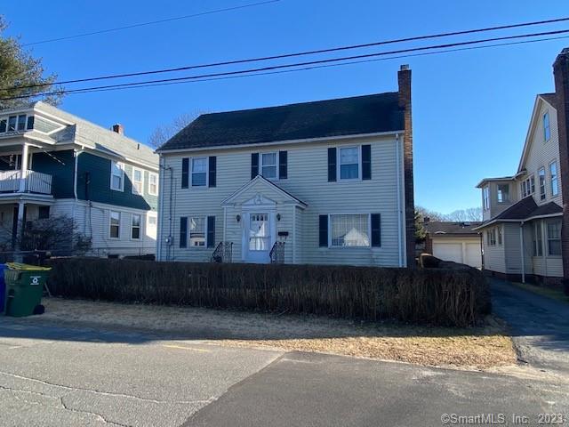 709 Washington Ave Extension Waterbury, CT 06708 - Photo 1 of 1 a front view of a house with a yard