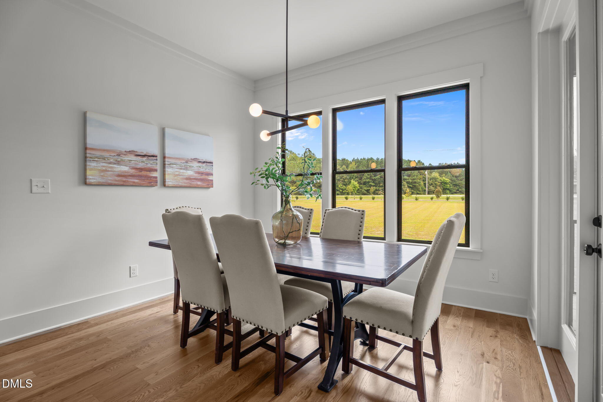 200 Broadleaf Lane Louisburg, NC 27549 - Photo 10 of 57 a view of a dining room with furniture window and wooden floor