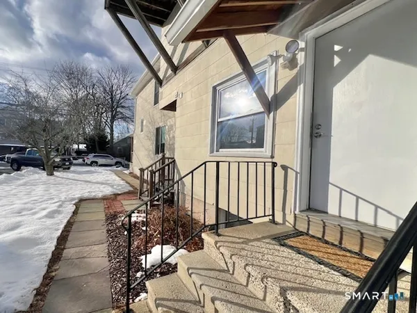 a view of a porch with furniture