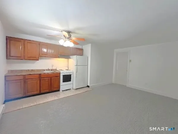a view of a kitchen with a sink and a window