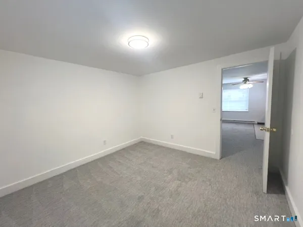 an empty room with a bathroom