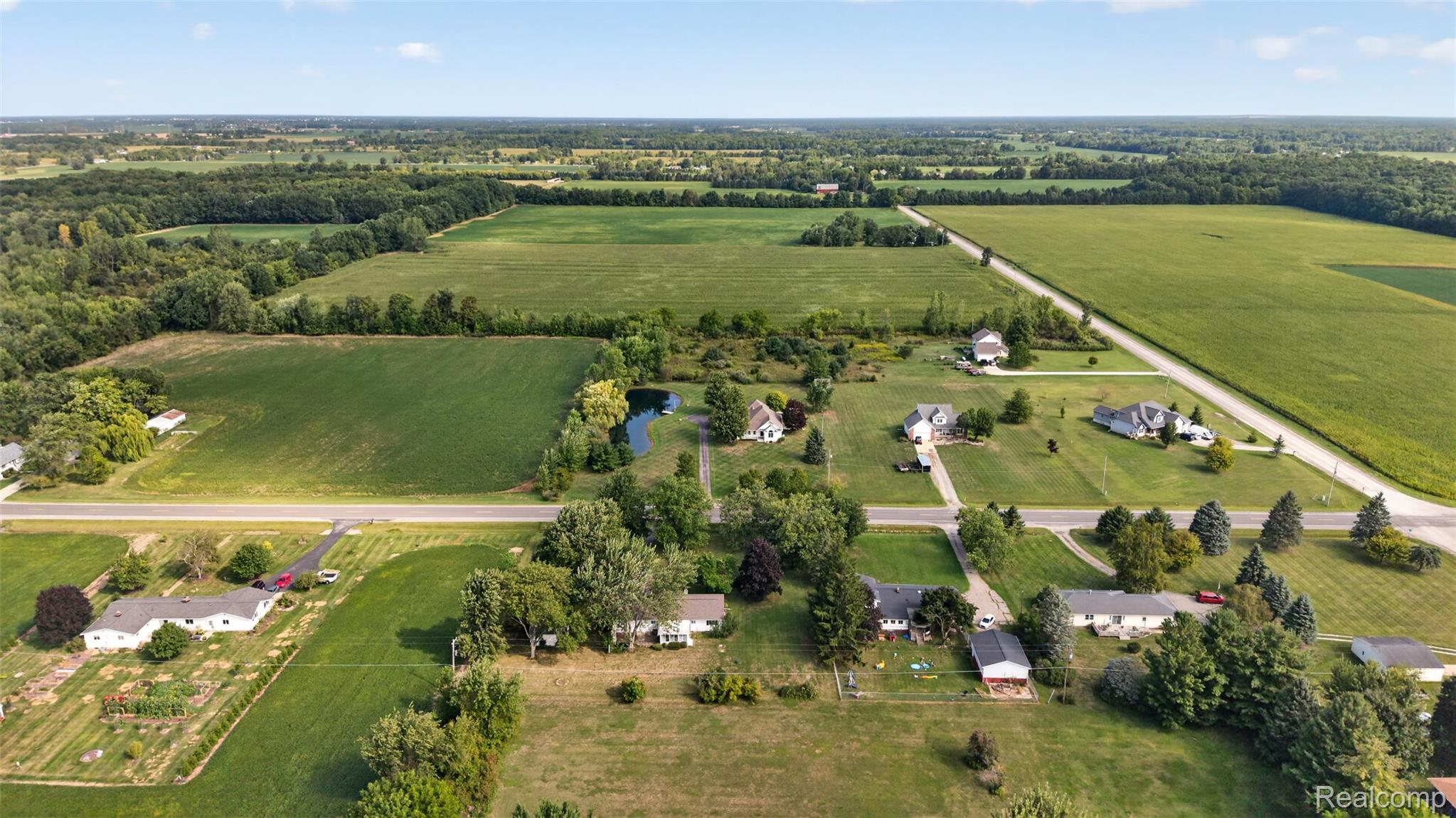 12055 West Pierson Road Flushing, MI 48433 - Photo 65 of 69 Expansive agricultural landscape with scattered residential properties and established roadways