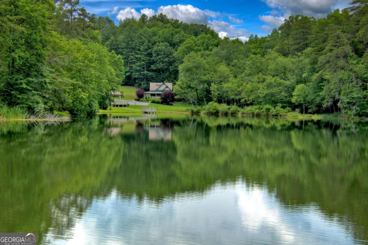 Lot 141 Fox Ridge, Unit 141 Blairsville, GA 30512 - Photo 22 of 31 a view of a lake with a house in the background