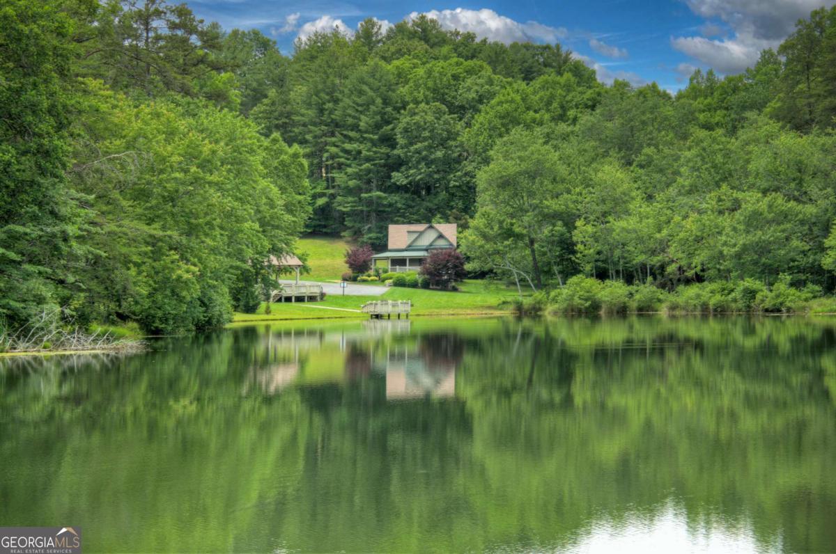 Lot 141 Fox Ridge, Unit 141 Blairsville, GA 30512 - Photo 24 of 31 a view of a lake with a house in the background