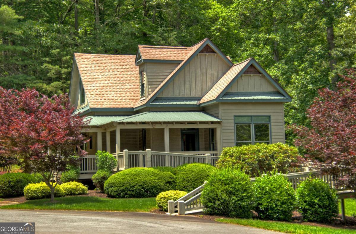 Lot 141 Fox Ridge, Unit 141 Blairsville, GA 30512 - Photo 27 of 31 a view of a white house with a small yard and plants