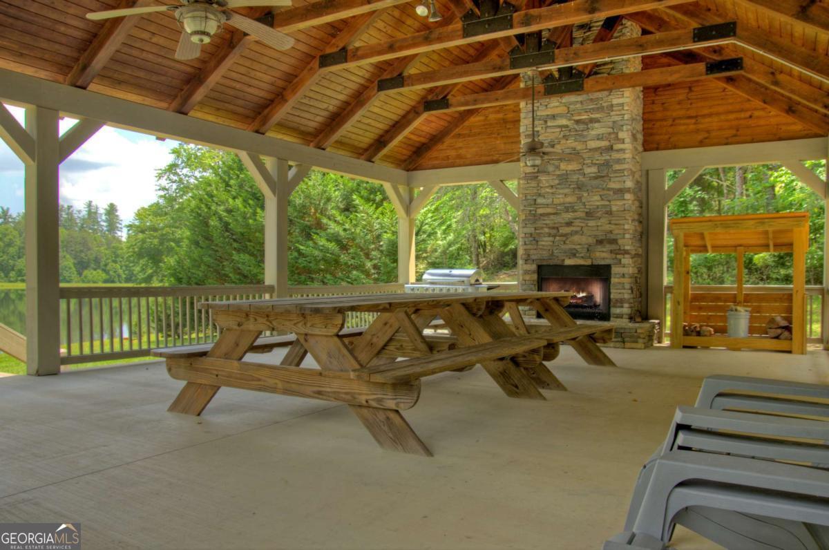 Lot 141 Fox Ridge, Unit 141 Blairsville, GA 30512 - Photo 29 of 31 a view of a patio with a table and chairs
