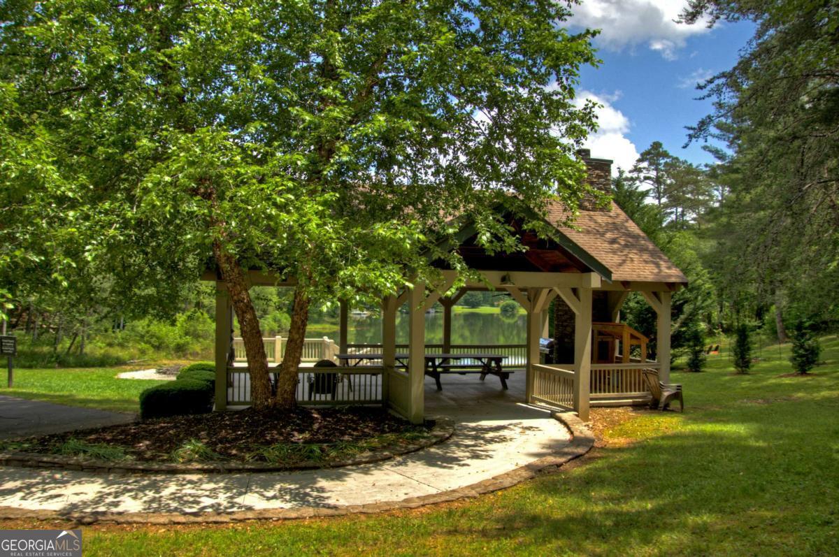 Lot 141 Fox Ridge, Unit 141 Blairsville, GA 30512 - Photo 30 of 31 a view of a house with backyard swimming pool and sitting area