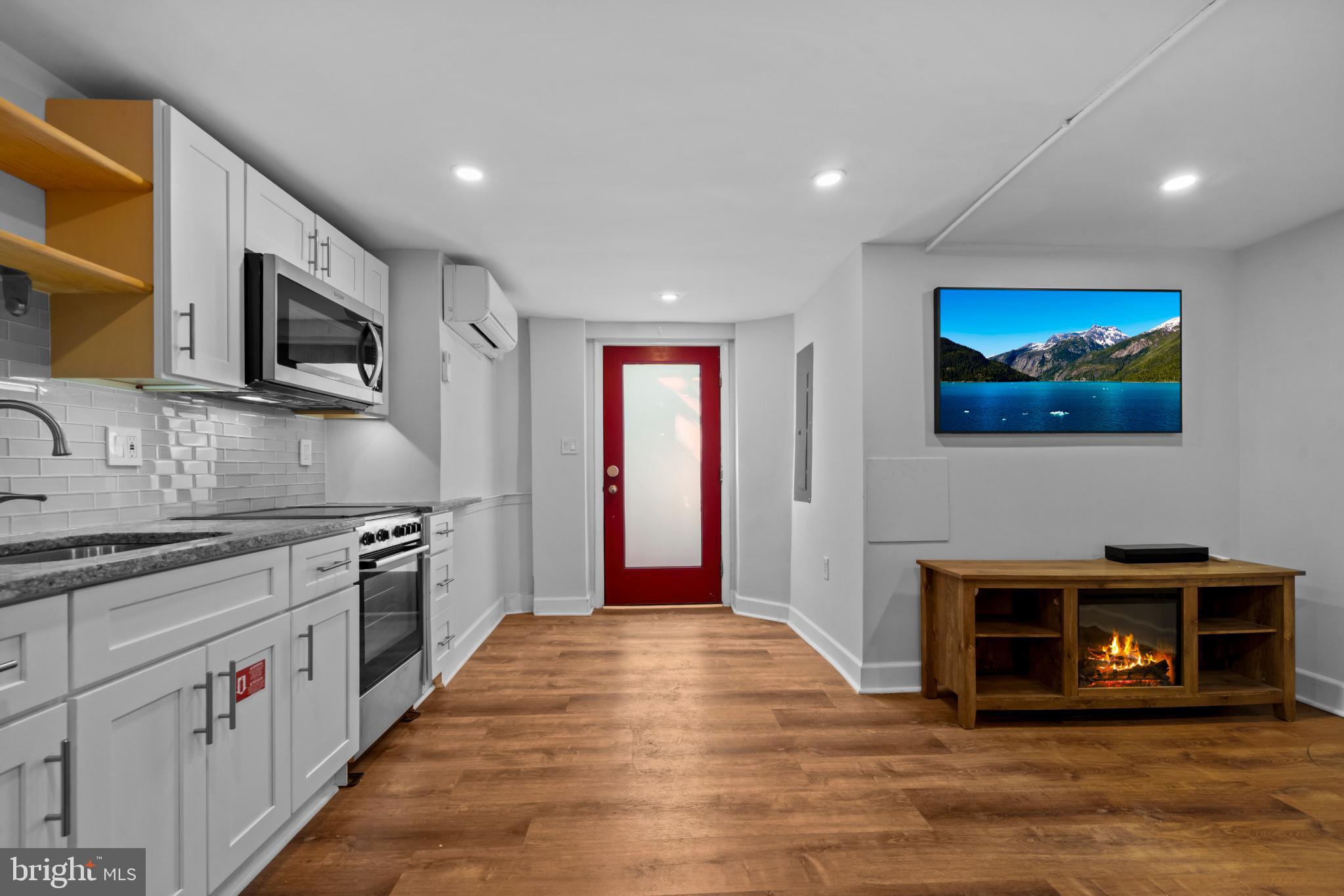 503 S Street Northwest Washington, DC 20001 - Photo 24 of 36 Modern kitchen with vibrant red accents.