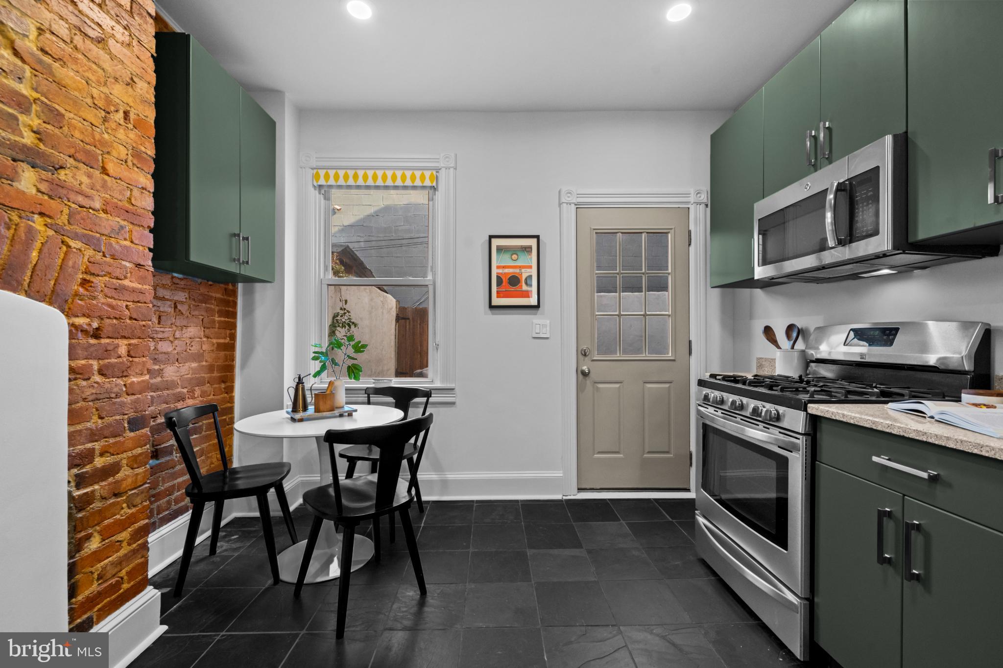 503 S Street Northwest Washington, DC 20001 - Photo 7 of 36 Charming kitchen with rustic brick accents.