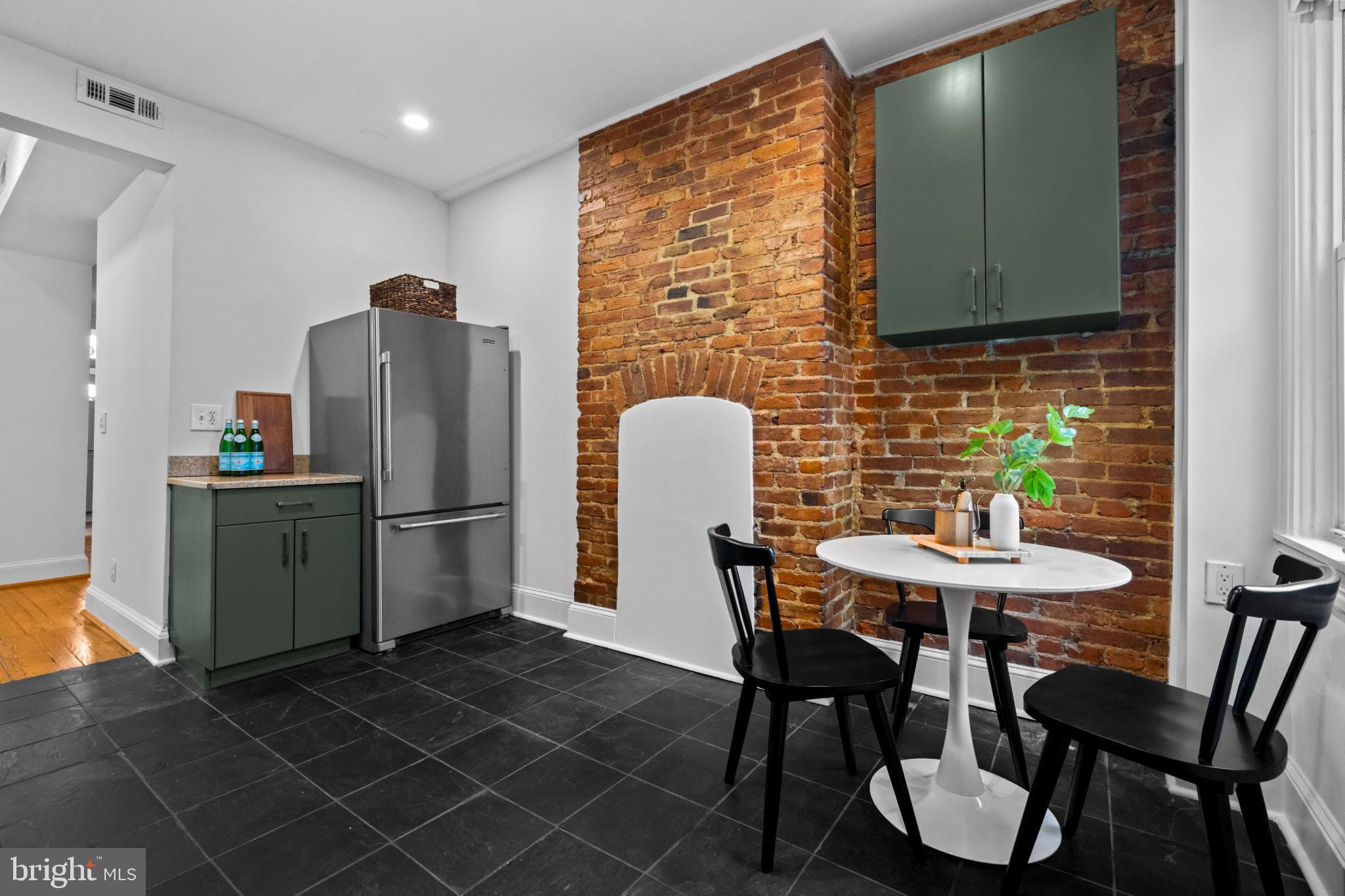 503 S Street Northwest Washington, DC 20001 - Photo 9 of 36 Charming kitchen with exposed brick accents.