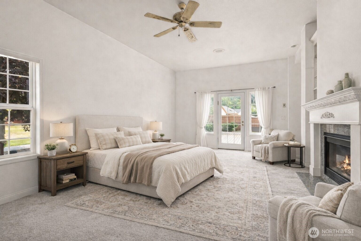 9609 346th Street South Roy, WA 98580 - Photo 12 of 31 a spacious bedroom with a bed a couch and large window