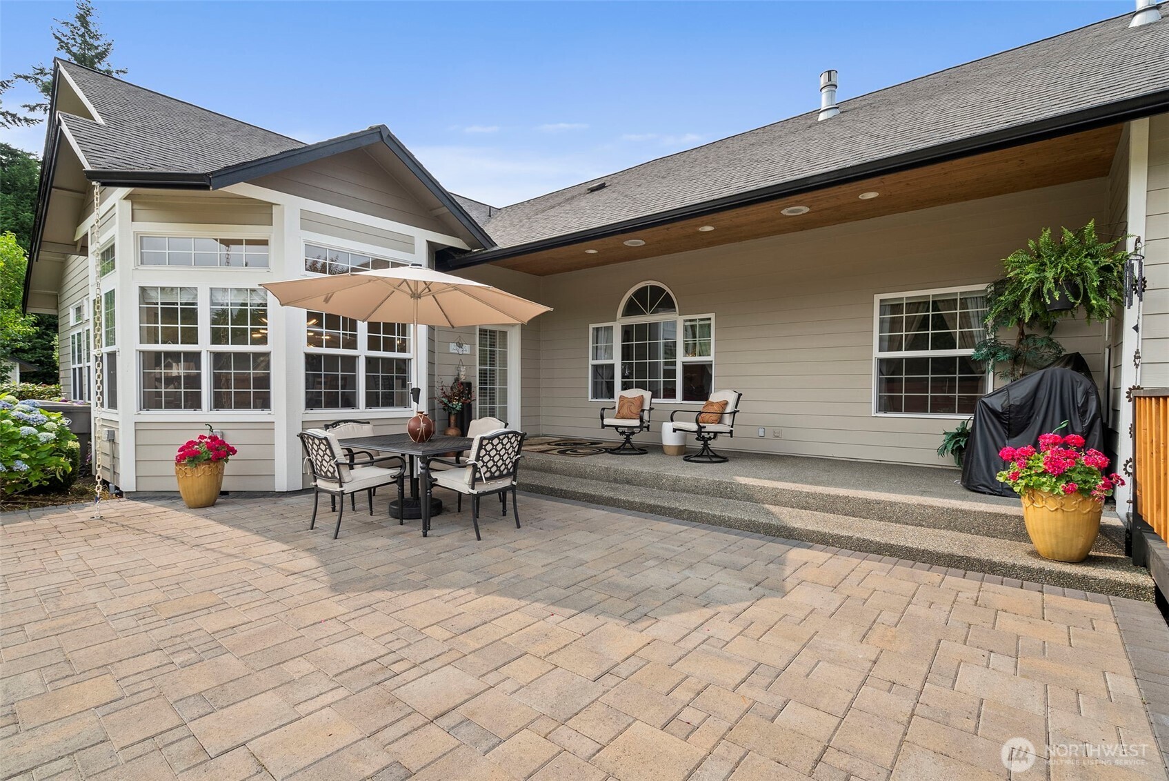 9609 346th Street South Roy, WA 98580 - Photo 28 of 37 a view of a patio with table and chairs and potted plants
