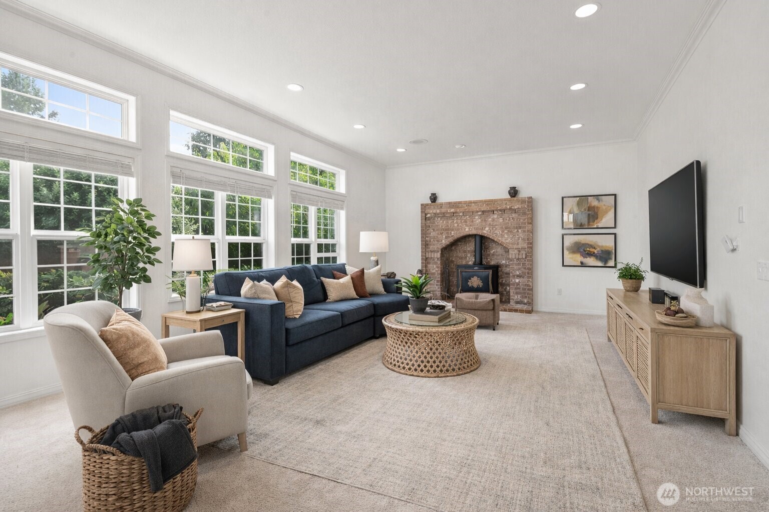 9609 346th Street South Roy, WA 98580 - Photo 5 of 31 a living room with furniture a fireplace and a flat screen tv
