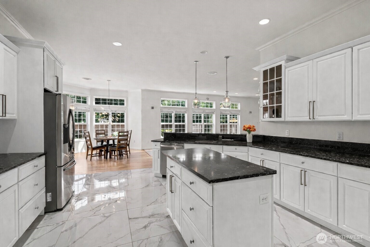 9609 346th Street South Roy, WA 98580 - Photo 6 of 31 a kitchen with granite countertop a sink a stove and refrigerator