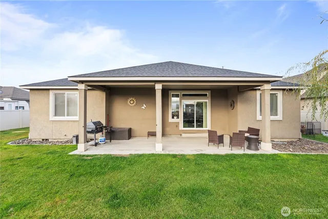 a group of chairs in front of house