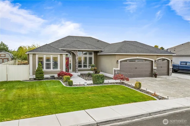 a front view of house with yard and outdoor seating