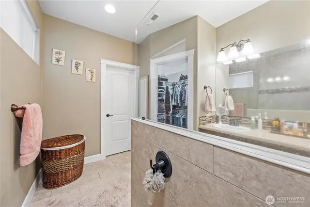 a dining room with furniture and chandelier