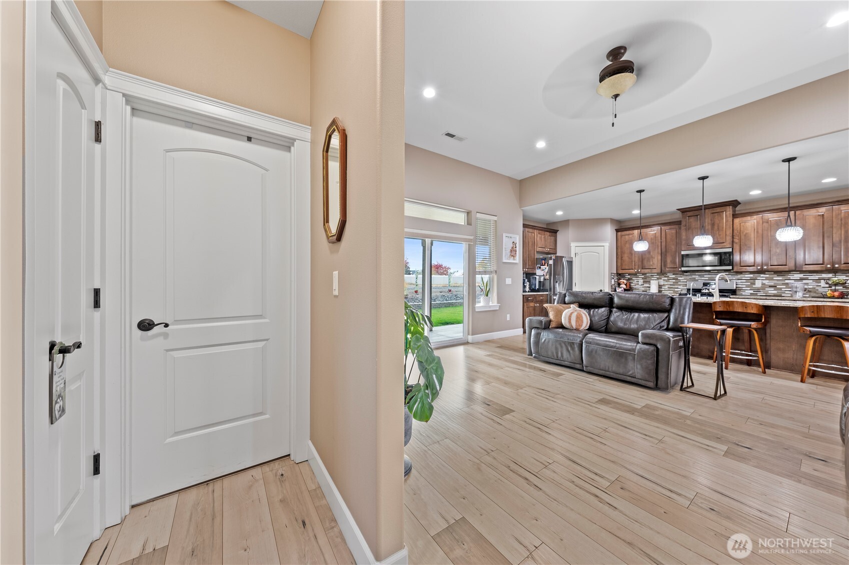1830 East Madera Street Othello, WA 99344 - Photo 4 of 35 a living room with furniture and a refrigerator