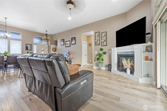 a living room with fireplace furniture and a flat screen tv