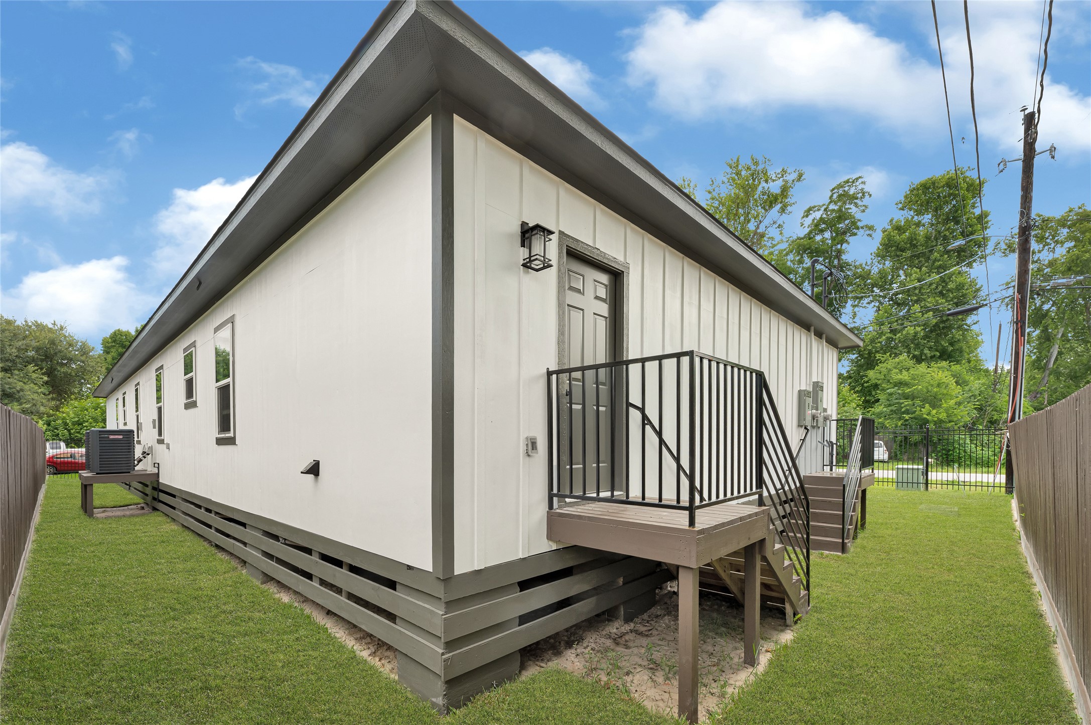 5930 Boness Road, Unit A & B Houston, TX 77396 - Photo 35 of 43 The left side of the home features custom-fabricated metal handrails leading to the side entry doors.