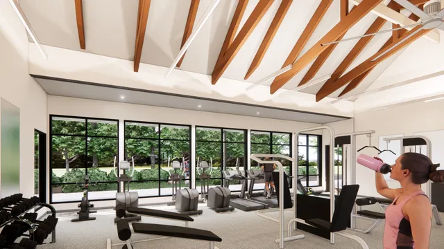 a living room with patio furniture and floor to ceiling windows