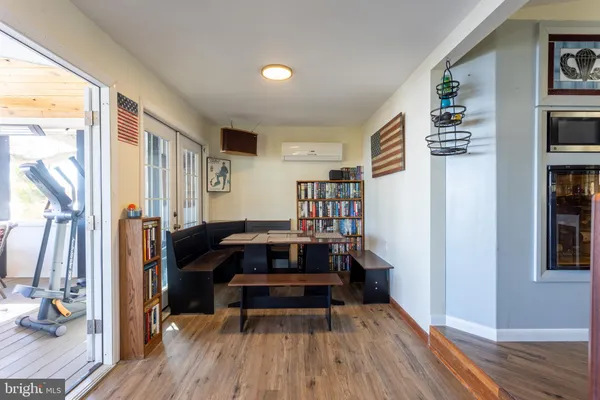 a bedroom with furniture and a book shelf