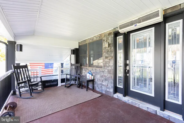 a room with lots of furniture and windows